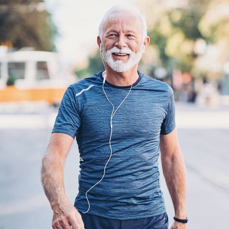 healthy-man-blue-shirt Man walking wearing a blue shirt