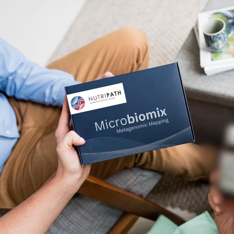 microbiomix-1 Someone holding a Microbiomix microbiome test kit box
