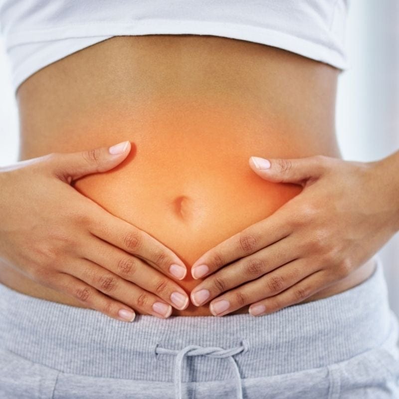 microbiomix-5 A person holding their sensitive belly