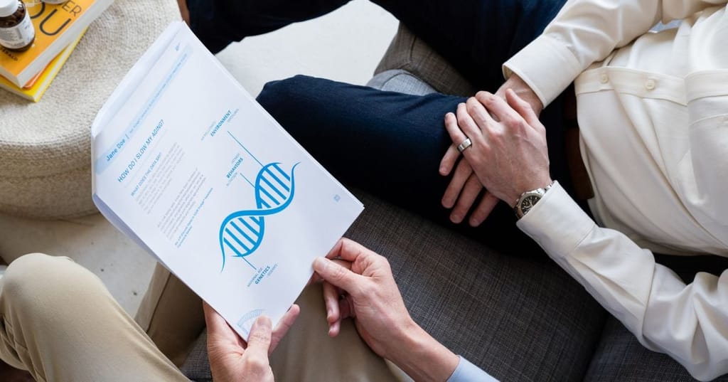 functional medicine practitioners sitting on couch reviewing printed truage test results