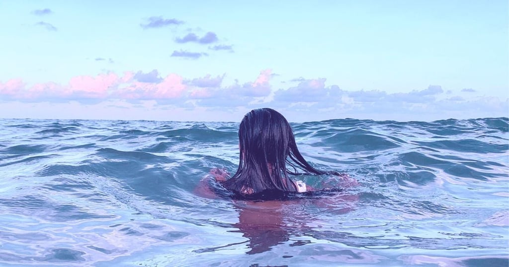 woman immersed in the sea for cold water therapy