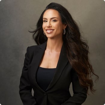dr-gabrielle-lyon fit toned woman in midlife long brown hair wearing suit smiling