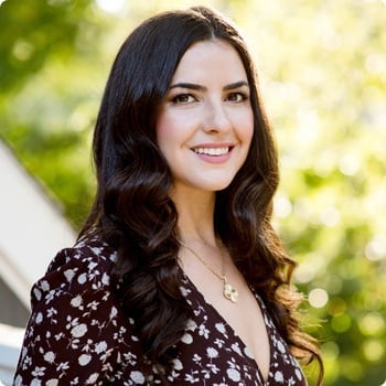 dr-molly-maloof young woman standing outside smiling long hair