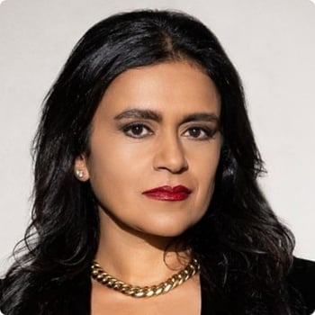 dr-tara-swart front profile of woman thick gold necklace long dark hair