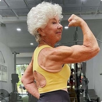 joan-mcdonald older woman flexing bicep in gym