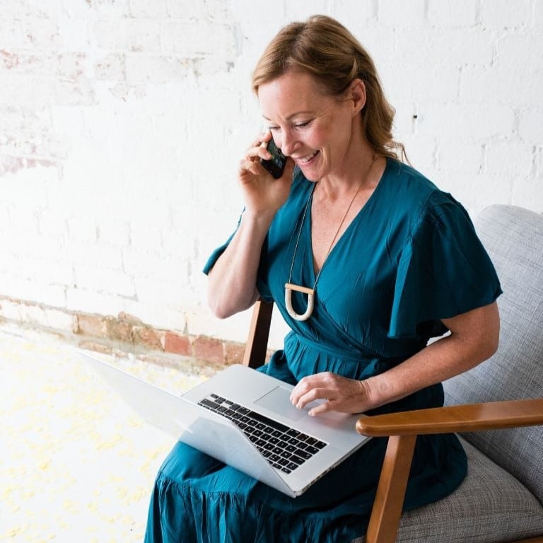 melbourne-functional-medicine-contact-hero-desktop-1 fit middle aged woman in athletic clothes pausing mid coastal run to bend forward and rest hands onto knees