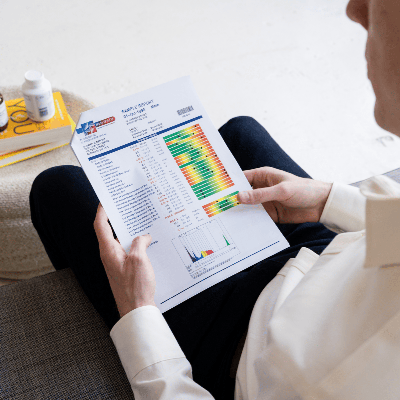 shop-australias-best-blood-test-6 A functional medicine practitioner holding an advanced blood test report