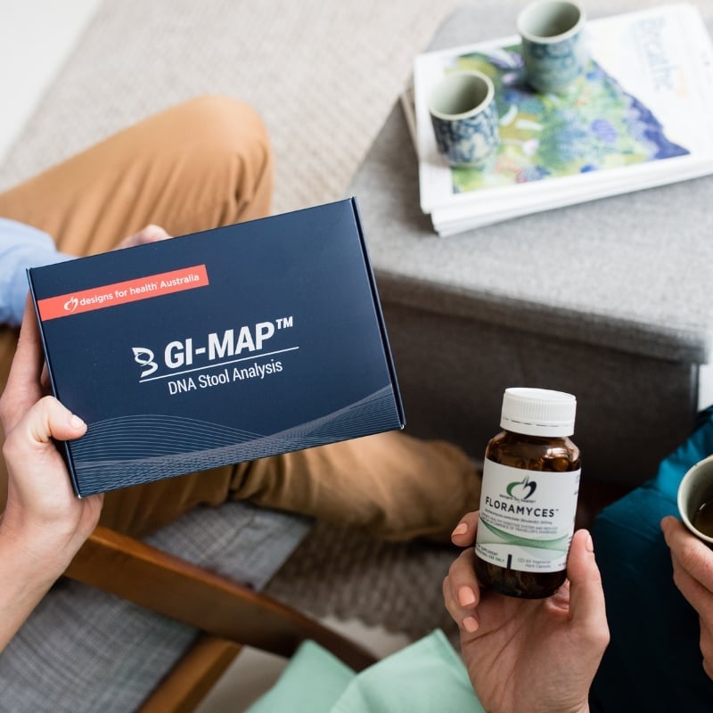 staff-holding-gimap-test-kit mark payne functional medicine practitioner chatting with liv brown health coach