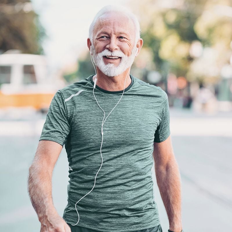 Photo of a man in his sixties walking down a street